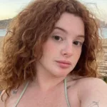 Briggitte Bozzo smiling confidently, representing her rising net worth in 2025